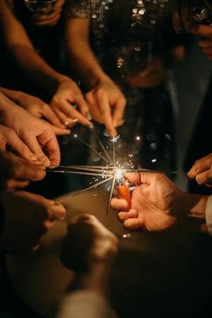 People with sparklers in their hands